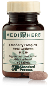 A bottle of Cranberry Complex next to a tablet.